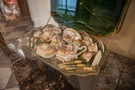 A close-up of specimens of antique porcelain presented in the gallery