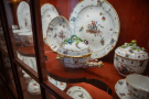 A close-up of specimens of antique porcelain presented in the gallery